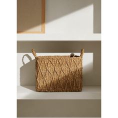 a woven bag sitting on top of a shelf