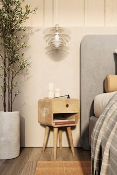 a bed room with a neatly made bed and a plant on the nightstand next to it