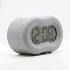 an alarm clock is displayed on a white surface with the time 11 20pm to 3 30 pm