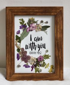 a wooden frame with flowers and the words i am with you