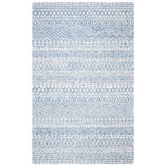 a blue and white rug with an abstract design