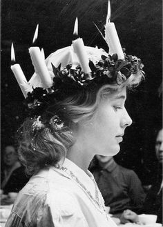 a woman with candles in her hair