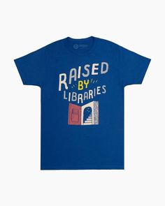 This colorful short sleeve tee is perfect for librarians and anyone who loved browsing library shelves as a kid! The stylish graphics and unisex fit make this a shirt that anyone can enjoy.100% cotton fitted teeDistressed, softened printColor: royal blueDesign by Mikey BurtonShort sleevesCrew neck Library Shirt, Library Tote Bag, Library Tote, Yellow Tote Bag, Literacy Programs, Donate Books, Book Tshirts, Library Card, Tee Design