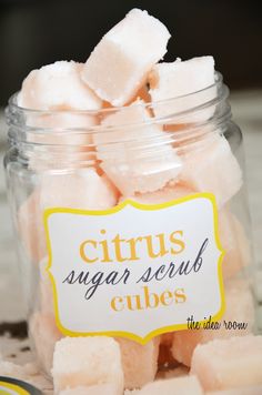 a jar filled with sugar cubes sitting on top of a table