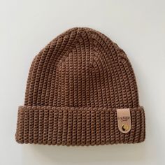 "This ribbed beanie is the perfect addition to anyone's wardrobe. Crafted from a blend of wool and acrylic materials, it offers a lightweight and comfortable fit. The textured ribbing detail adds style and texture to any outfit. This classic style is timeless and perfect for cold winter days. The beanie is available in three sizes and in a variety of colors. The warm material will keep you cozy and fashionable all winter long. Get yours today and stay warm while looking your best! 🧶 Adult, children and baby sizes available   🧶 Unisex  🧶 Available in a selection of colours  🧶Adjustable folded brim  🧶 Can be customised 🌱Vegan Leather label   Beanie Composition: 50% Merino Wool 25% Acrylic  25% Microfibre OR  100% Acrylic  Sizing.                         Height (with 2 inch brim) Baby. Brown Knitted Beanie One Size, One Size Brown Knit Beanie, Brown Beanie Cap, One Size Fits Most, Crochet Ribbed Beanie, Brown Hand Knitted One-size Beanie, Brown Wool Beanie, One Size Fits All, Winter Hat Crochet, Crochet Bonnet, Hat Inspiration