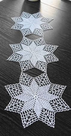 white crocheted stars on a black table