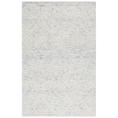 a white and blue rug with an abstract design