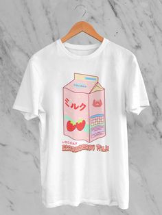 Welcome to our Etsy boutique, where style meets adorable sophistication! Explore our Japanese Kawaii Strawberry Milk T-Shirt -- a delightful fusion of Japanese cuteness and contemporary flair. This tee boasts a sweet strawberry milk illustration featuring irresistibly charming strawberries and the essence of kawaii culture. Crafted from premium materials, this shirt ensures comfort without compromising on style. The Japanese-inspired design adds a touch of playful elegance to your wardrobe, making it a must-have for those who appreciate the art of kawaii fashion. Each shirt is a canvas of sweetness, blending the iconic strawberry motif with the popular Japanese aesthetic. Our Kawaii Strawberry Milk T-Shirt is not just a garment; it's a statement. Perfect for casual outings or expressing yo Milk Illustration, Cat Strawberry, Bleach Alternative, Kawaii T Shirt, Kawaii Strawberry, Cute Animation, Kawaii Culture, Chat Kawaii, Etsy Boutique