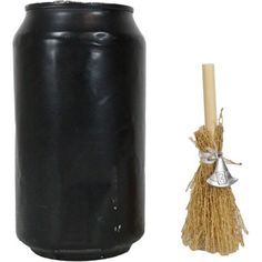 a black can with a broom next to it