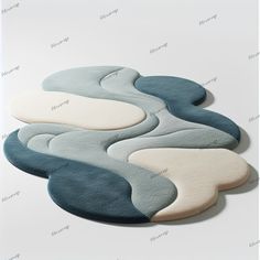 the rug is designed to look like an ocean wave with white, blue and gray colors