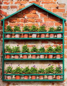 a brick wall with plants on it and the words simple container garden on a wall