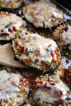 some food that is sitting on a pan and next to a bowl of chili sauce