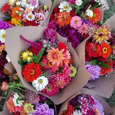 a bunch of flowers that are laying on the ground in some kind of bouquets