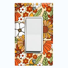 a light switch cover with an orange and white flower pattern on it's side