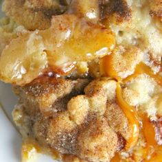 a close up of food on a plate with sauce and bread crumbs in it