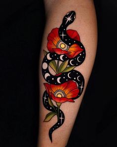 a woman's arm with flowers and a snake tattoo on the left side of her body