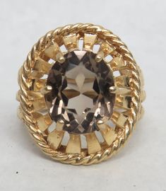 WEIGHS 7.7 GRAMS TOTAL 14K YELLOW GOLD / SIZE 7 1/4 / FACE OF RING MEASURES 18.5MM WIDE X 21.5MM TALL SIDE PROFILE OF RING STANDS APPROX 9MM OFF FINGER  Contact our office for any questions you may have  We are available Monday - Friday 10am-5pm EST All emails sent over the weekend will be answered on Monday We deal with preowned, vintage, estate items and collectables. The word excellent is used only to describe the condition based on its age. That does not mean the item is in perfect or new condition. Please have reasonable expectations when purchasing items from our store and ask any questions prior to making your purchase. INTERNATIONAL SHIPPING Import  taxes and charges are NOT included in the item price or shipping charges.  It is the buyer's responsibility to check with your country Smokey Topaz Ring, Antique Jewelry Rings, Retro Era, Smokey Topaz, Ring Stand, Side Profile, Smokey Quartz, Topaz Ring, Ring Size 7