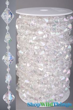 a white vase with crystal beads hanging from it's side and another photo of the vase