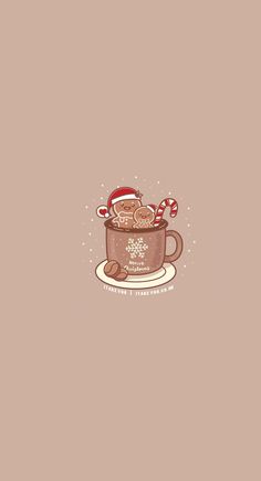 a cup filled with hot chocolate and candy canes