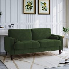 a green couch sitting on top of a white rug