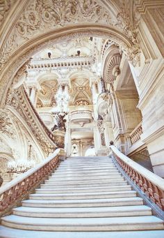 an ornate staircase leading up to the second floor