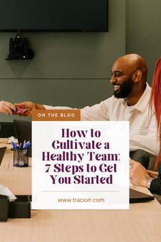 two people sitting at a table with a sign that says how to cultivate a healthy team 7 steps to get you started