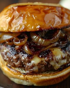 a hamburger with onions and cheese on it