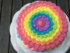 there is a colorful cake on the plate