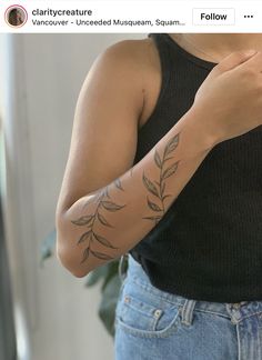 a woman with a tattoo on her arm