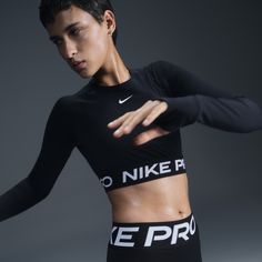 Get your sweat on in this cropped Nike Pro top. Lightweight and stretchy, the smooth fabric dries quickly to help you stay ready when your workout heats up. With a body-hugging fit and soft jacquard elastic band at the hem, you can feel secure as you crush your goals. Nike Activewear, Nike Workout Outfits Womens, Nike Fitted Crop Top For Workout, Nike Top, Nike Long Sleeve Tops For Gym, Nike Sweat-resistant Gym Tops, Nike Sports Bra Outfit, Compression Long Sleeve Sports Crop Top, Long Sleeve Moisture-wicking Crop Top For Sports