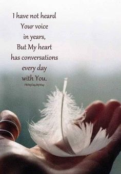 a person holding a feather in their hand with a quote on the side that says i have not heard your voice in years, but my heart has conversations every day with you