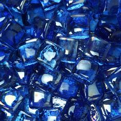 blue glass cubes are stacked on top of each other in the shape of squares