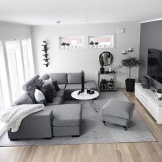 a living room filled with furniture and a flat screen tv