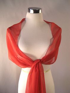 "IMPORTANT - Read all \"ITEM DETAILS\" before ordering. Evening Wrap - Red Chiffon Wedding Wrap - Shawl Stole Drape - Formal Red Chiffon Bridal Shawl - Extra Long Bridesmaid Scarf - Custom Made Lightweight, silky, sheer chiffon fabric. Red solid. A myriad of colors. Edges are serged with a classic rolled hem. ** Choice of squared or tapered ends. ** DIMENSIONS: Approximately 104 inches in length. Approximately 16 inches in width. Hand wash cool and lay flat or hang to dry. May be ironed with a w