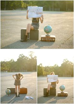 a woman sitting on suitcases holding a map