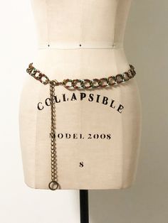 This is an adjustable chain belt with an antiqued gold tone finish. Each link is decorated with multi colored stones to include amber, green, red and light blue. The jeweled portion of the chain measures 30 inches. The adjustable portion measures 10 inches. Nice lobster claw clasp. Always happy to answer questions. All sales considered final unless item is grossly misrepresented. Thank you for shopping with us at We Wear Vintage! Bohemian Gold Chain Belt, Vintage Adjustable Chain Belt For Party, Bohemian Gold Chain Belt With Adjustable Chain, Bohemian Style Adjustable Metal Chain Belt, Vintage Metal Chain Belt With Adjustable Chain, Vintage Gold Chain Belt For Festivals, Adjustable Metal Waist Chain Belt, Metal Chain Belt With Belt Loops For Festivals, Adjustable Metal Chain Belt