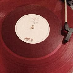 an old record player is sitting on top of a red turntable with the words too big mama printed on it