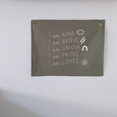 a sign on the wall that says i am kind of brave, i am unique, i am proud, i am loved