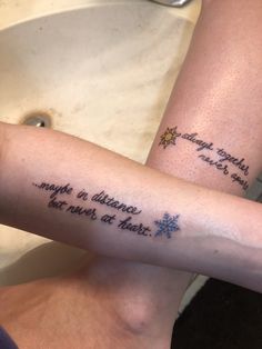 two people with tattoos on their arms that say, maybe distance is always at the end