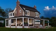 a large house with a porch and covered patio