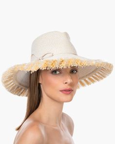 If you are looking for a woman's sun hat for sale online that is sure to turn heads, look no further! Named from the Caribbean Island that has endless beaches and warm turquoise water, this sun hat made of Squishee®, is a show stopper. This flirty, tropical sun hat combines the pinched crown of a fedora with a wide brim, edged all around with glamorous straw fringe. Wherever you adventure, from St. Barths to Antibes, approving smiles are sure to follow! Squishee® straw is a sustainable man-made Lightweight Straw Hat For Poolside, Kentucky Derby Wide Brim Fedora For Beach, Upf 50+ Fedora For Kentucky Derby Vacation, Cream Wide Brim Straw Hat For Beach, Lightweight Panama Hat For Sunbathing, Cream Fedora Sun Hat For The Beach, Cream Beachy Hat For Vacation, Upf 50+ Fedora For Beach And Kentucky Derby, Upf 50+ Fedora For Kentucky Derby And Beach