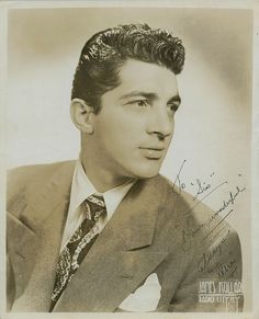 an old black and white photo of a man in a suit