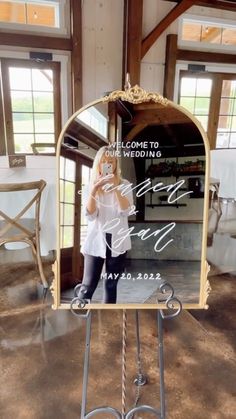 a woman standing in front of a mirror with the words welcome to our bride on it