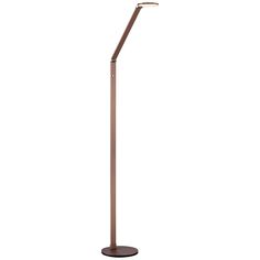 a floor lamp with a dim light on it