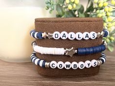 Custom clay beaded bracelet stack to support America's Team! Bracelets pictured as a set of three but this listing is for a single bracelet only. Feel free to message me if you would like a word or phrase not shown in the picture! Dallas Cowboys Bead Bracelets, Dallas Cowboy Bracelet, Clay Beaded Bracelet, Make Clay Beads, Beaded Bracelet Stack, Stacked Beaded Bracelets, Team Bracelets, Homemade Bracelets, Single Bracelet