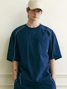 This is a casual and comfortable t-shirt that is made out of high quality nylon and spandex blend fabric. With design detail of color contrasting piping detail overall and minimal logo embroidery on the chest pocket, it gives a trendy and refined look. - Semi oversized silhouette- Chest patch pocket with logo embroidery- Adjustable string and stopper on the hem- Piping detail Mens Shirt Illustration, Navy Sporty Top With Pockets, Mens Street Wear, Mens Denim Shirt, Color Block Tshirt, Minimal Embroidery, Model Illustration, Sportswear Details, Minimal Shirt Design