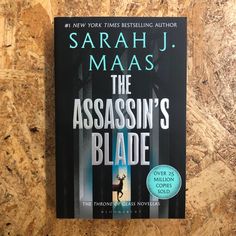 the book cover of the assassin's blade by saraah j maas