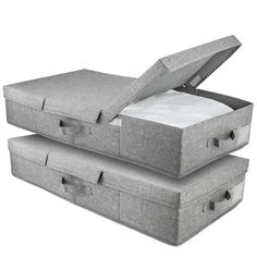 two grey storage boxes with lids open and one closed on the bottom, both filled with white sheets