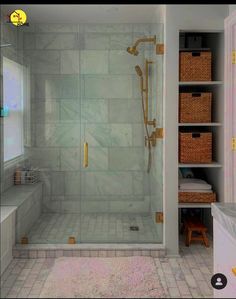 a bathroom with a walk in shower next to a toilet