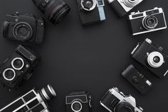 many different types of cameras arranged in a circle on a black background with space for text